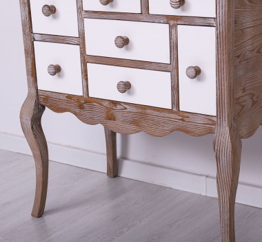 Console with curved legs and 7 multicolored drawers